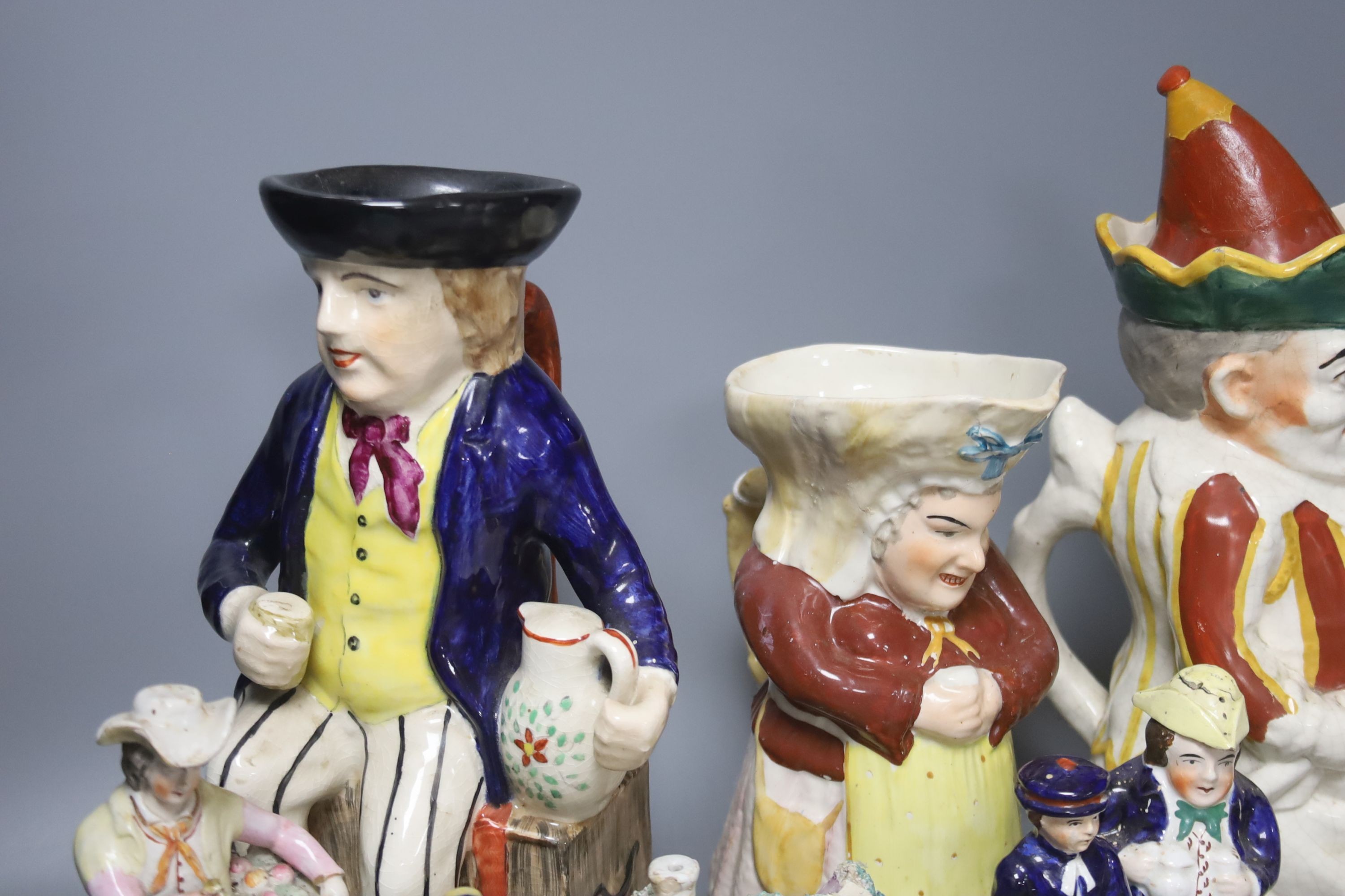 A group of assorted 19th century and later Staffordshire ceramics including a Toby jug, Colston Boy and Red Maid Girl Bristol
